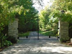 Stone pillar and sturdy steel gate