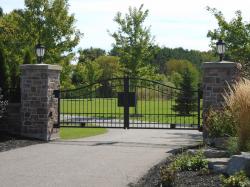 Stone pillar and sturdy steel gate