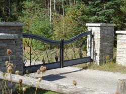 Custom Nature lover design steel gate with intercom/keypad and stone pillars