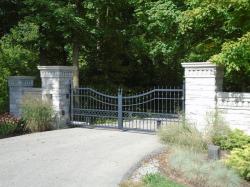 Black steel gate with keypad and custom design