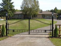 Lamps, keypad and intercom with painted black steel gate.