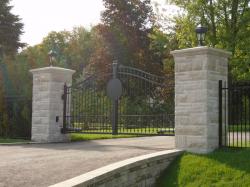 Steel gate with custom design for a logo or number. With matching fences