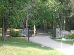 Stone Pillars and Black metal Gate with the works Blue Ridge