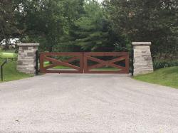 Simplistic Design Wood Gate With Stone Pillars & Intercom
